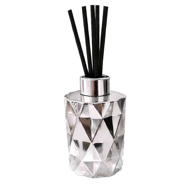 silver geometric diffuser bottle with black reeds