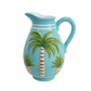 Turquoise pitcher with palm tree design 