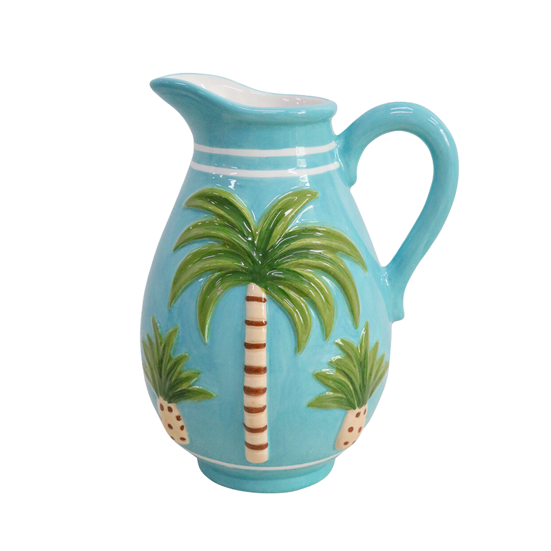 Turquoise pitcher with palm tree design 