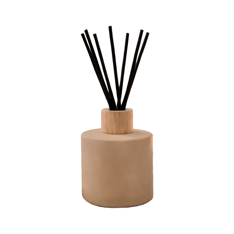 Diffuser with black reeds in a tan container 