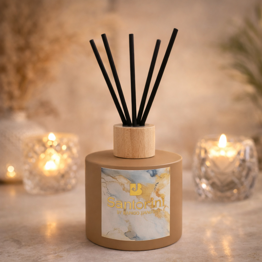 Santorini diffuser with black reeds on a blurred background with candles