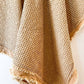 Close-up of light rust cotton waffle weave and frayed edge detail