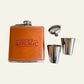 A men's flask set with a brown leather-look flask, silver metal cap, and two stainless steel shot glasses on a white background. The flask is embossed with the text 'MEN'S REPUBLIC'.