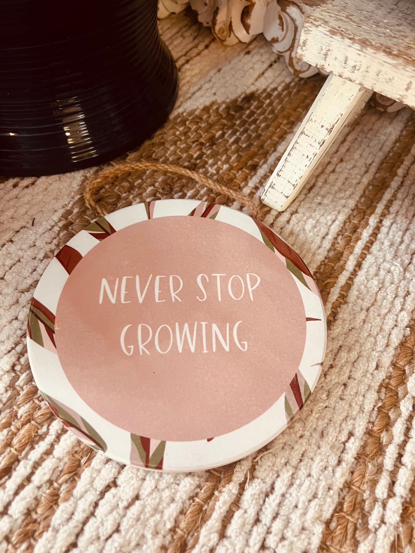 Never Stop Growing Hanging Sign