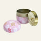 Pink pineapple trinket tin shown open with removable gold-tone lid.